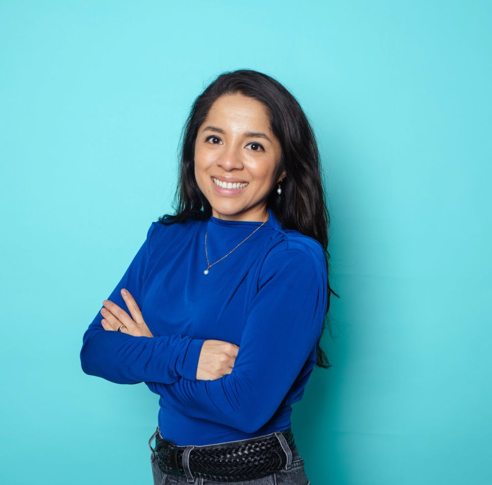 Woman smiling with blue background